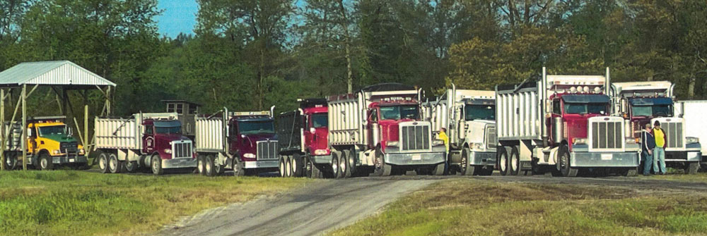 dump trucks in line